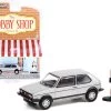1976 Volkswagen Golf MkI GTI Silver Metallic And Race Car Driver Figurine "The Hobby Shop" Series 11 1/64 Diecast Model Car By Greenlight